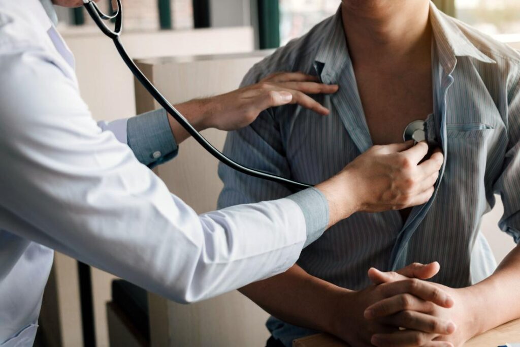 Doctor performing a physical examination on a patient with a stethoscope